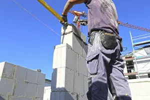 Bricklayer Detail Prints: Construction worker (bricklayer) on the building site