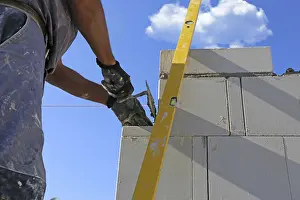 Bricklayer Detail Prints: Construction worker (bricklayer) on the building site
