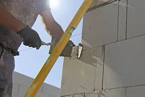 Bricklayer Detail Prints: Construction worker (bricklayer) on the building site