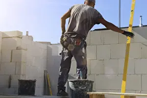Bricklayer Detail Prints: Construction worker (bricklayer) on the building site