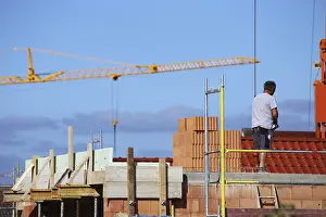 Central Europe Residential Building Prints: Construction worker (bricklayer) on the building site (Mutterstadt development area)
