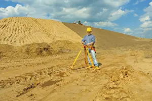 Safety Helmet Image Prints: Construction worker with theodolite