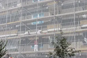 Construction Site Prints: Construction workers among scaffolding