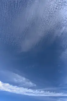 Central Europe Cloudy Days Prints: Contrails and cloud formations in the blue sky