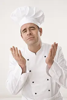 Studio Shot Of A Chef Prints: Cook gesticulating