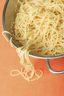 Studio Shot Of Spaghetti Prints: Cooked spaghetti in the sieve