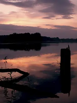 Evening Light On Water Prints: Cool dramatic sunset lake