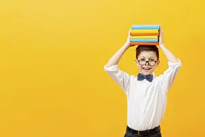 Education Background Image Prints: Copy space boy holding stack books