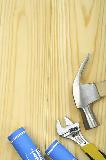 Studio Photography Prints: Copyspace image of hammer spanner and blueprints