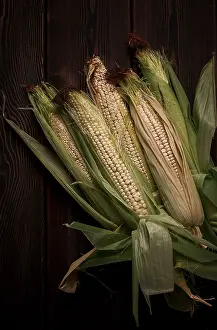 Rustic Food Style Prints: Corn cobs, on a wooden table, top view
