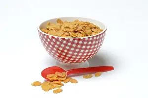 Cornflakes In A Bowl Prints: Cornflakes in bowl, in front plastic spoon