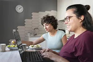 Modern Home Design Prints: A couple sitting at a kitchen table