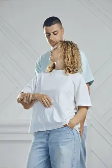 Caucasian Ethnicity Couples Prints: Couple stands close in studio setting