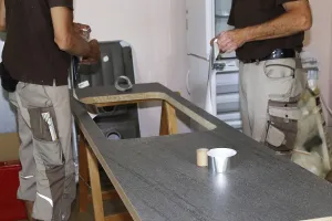 Craftsmen At Work Prints: Craftsmen installing a new kitchen (kitchen assembly)
