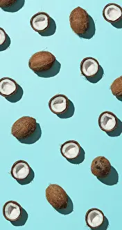 Urban Environment Image Prints: Creative layout of coconuts half on blue background