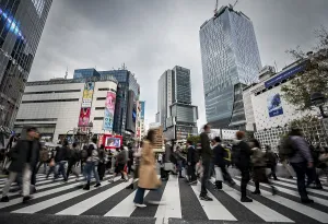Long Exposure Images Prints: Crowd crossing zebra crossing on a large intersection