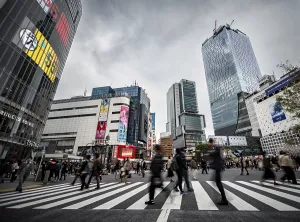 Long Exposure Images Prints: Crowd crossing zebra crossing on a large intersection