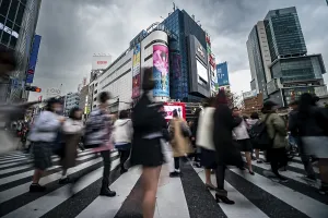 Long Exposure Images Prints: Crowd crossing zebra crossing on a large intersection