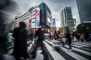 Long Exposure Images Prints: Crowd crossing zebra crossing on a large intersection