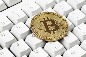 Bitcoin Cryptocurrency Symbol Prints: Cryptocurrency on computer keyboard