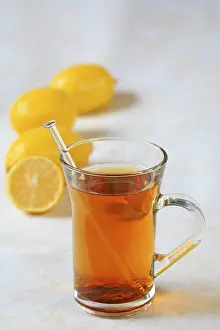 Lemon Infused Tea Prints: A cup of tea with lemons