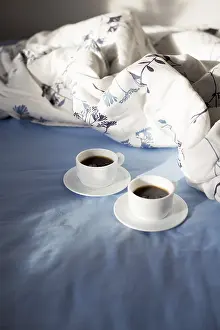 Deserted Breakfast Table Prints: Two cups of coffee in bed, sunlight