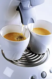 Coffee Cup Close Up Prints: Two cups placed under an espresso machine
