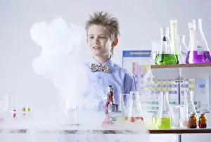 Young Researcher Prints: Curious pupil posing with test tubes and flasks