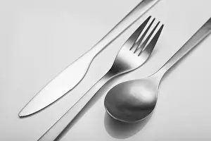 Sterling Silver Cutlery Set Prints: Cutlery on white table. Minimal designed fork