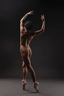 Ballet Dancer Pose Prints: A dancer performs elegant ballet movements in a soft light