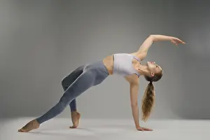Flexible Dancer Prints: A dancer performs an impressive flexible pose in a minimalist studio setting