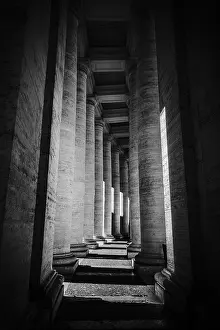 Classic Architecture Europe Prints: Dark black and white image of a colonnade with dramatic light and shadow