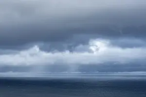 Cloudy Coastal Area Prints: Dark clouds over the Atlantic Ocean