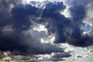 Stormy Atmosphere Europe Prints: Dark rain clouds shortly in front of thunderstorms