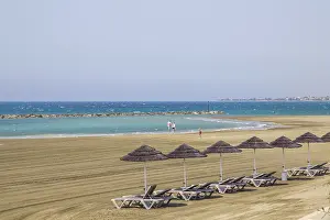 Deserted Beach Chairs Prints: Deck chairs, straw umbrellas, empty beach
