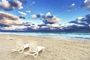 Deserted Beach Chairs Prints: Deckchairs on a beach on a background of ocean