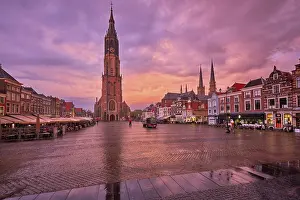 Prints of Delft, Netherlands, May 12, 2017: Nieuwe Kerk New Church protestant church on Delft Market Square Markt with dramatic sky on sunset. Delft, Netherlands Delft Prints: Delft, Netherlands Print: Nieuwe Kerk at Sunset