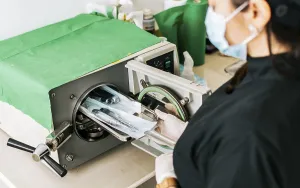 Healthcare Professional Work Prints: A dentist sterilizing his tools