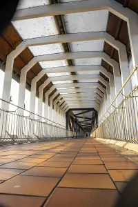 Deserted Train Station Building Prints: Depth effect in an empty architectural corridor with concrete structure and railings