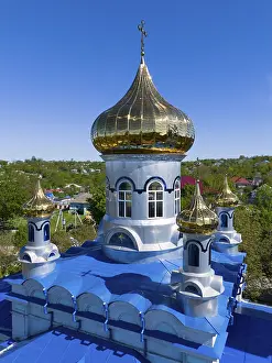 Prints of Detailed view of a golden dome on a blue roof under a blue sky, aerial view, Orthodox church, Biserica de iarnă, iarna, Tareuka, Ţareuca, Rezina district, Republic of Moldova Moldova Prints: Aerial View of Golden Orthodox Church Print, Moldova
