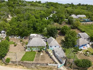 Prints of Detailed view of a small village surrounded by gardens and lush greenery, aerial view, Molovata, Dubasari district, Dniester river, Nistru, Republic of Moldova, Moldova Moldova Prints: Aerial View Print of Molovata Village, Moldova