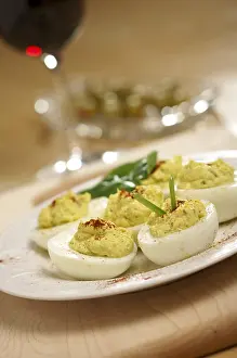 Empty Table Setting Photos Prints: Deviled eggs and appetizers on a decorative white plate