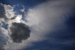 Backlit Cloud Formations Prints: Different cloud formations with sun emerging