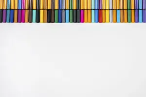Empty Desk With Writing Supplies Prints: Different coloured fineliners above