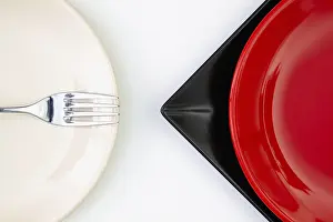 Flat Lay Photography Prints: Different red, black and plates on the white table