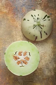 Exotic Tropical Fruit Prints: Dino melon, cut, on the table, top view