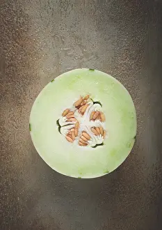 Ecological Food Photography Prints: Dino melon, cut, on the table, top view