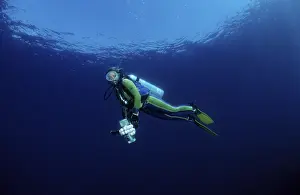 Underwater Photography Prints: Diver diving with camera equipment