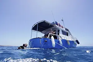 Gran Canaria Dive Site Prints: Divers aboard a dive boat are preparing for their trip