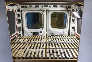 Images Dated 19th June 2024: DIY Camper Van Conversion Print: Handcrafted Bed Frame